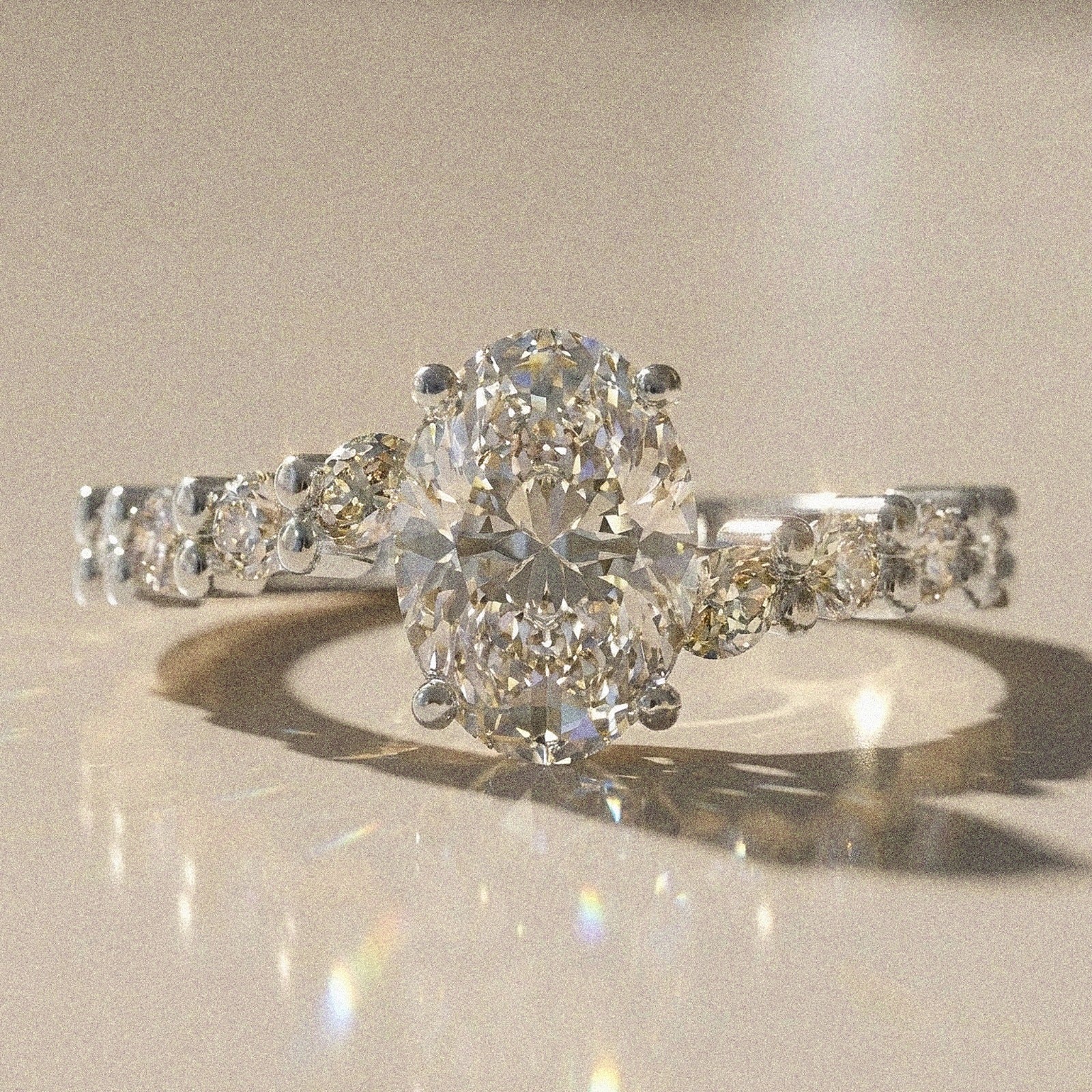 Bergenie - Oval stone engagement ring with side stones