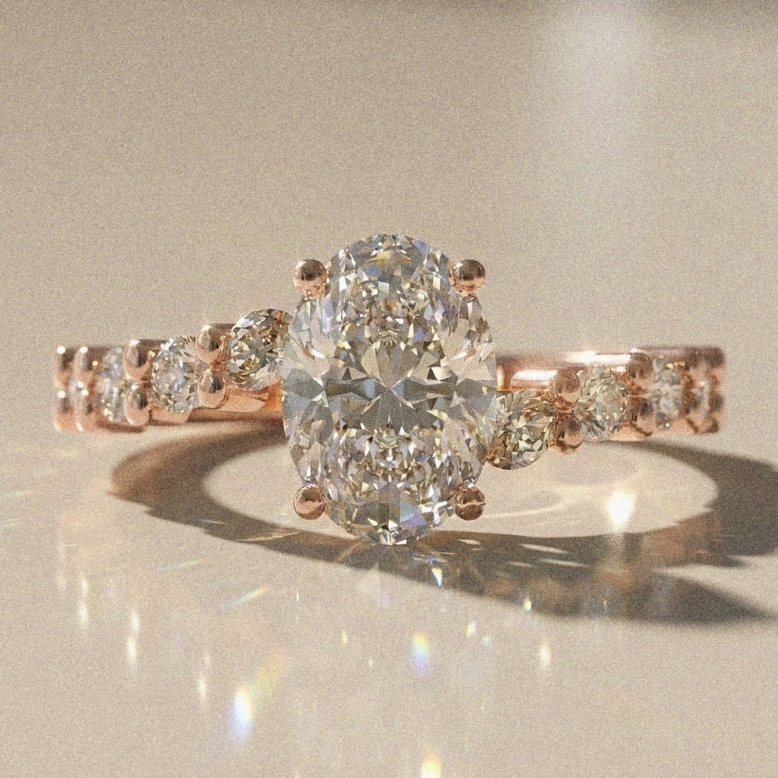 Bergenie - Oval stone engagement ring with side stones