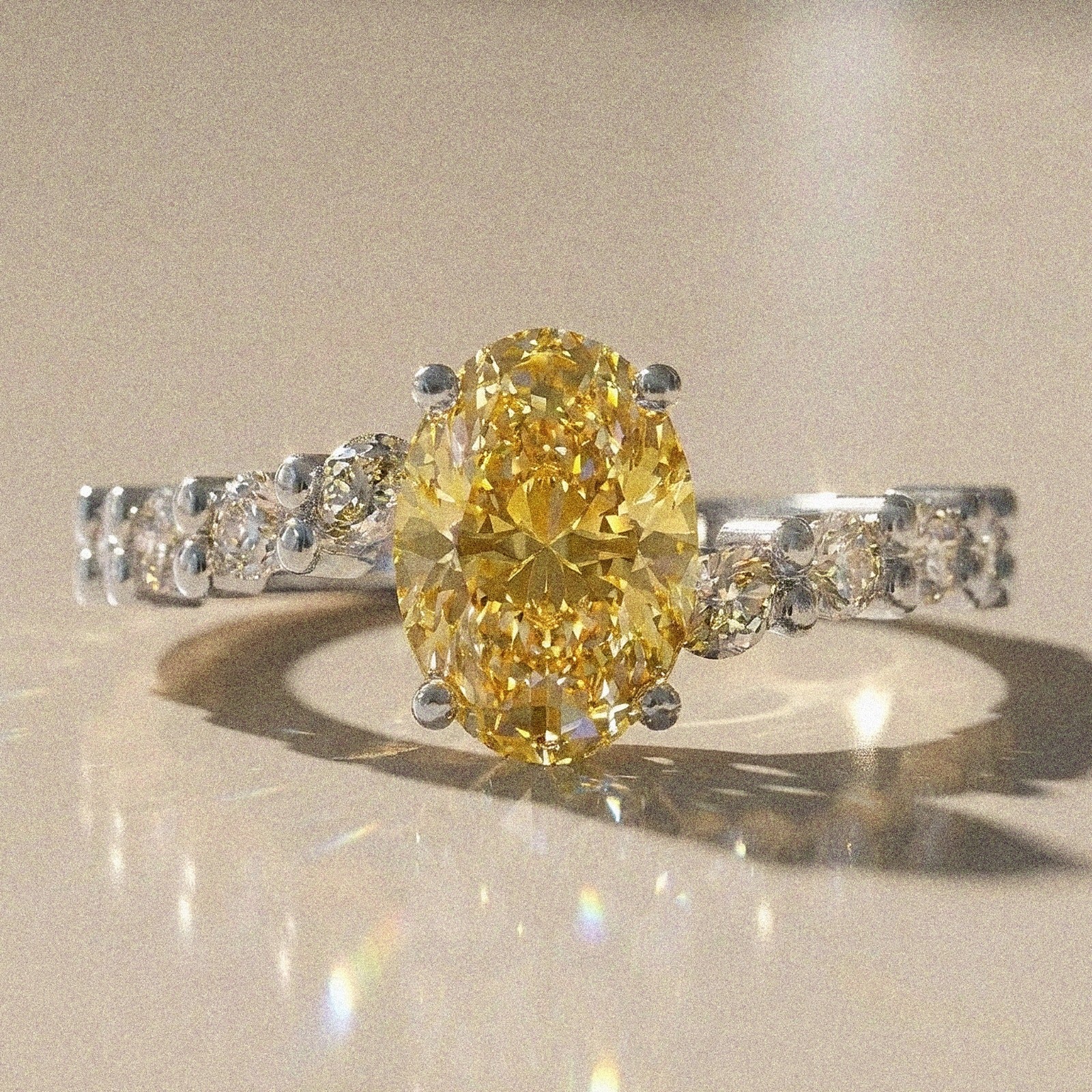 Bergenie - Oval stone engagement ring with side stones