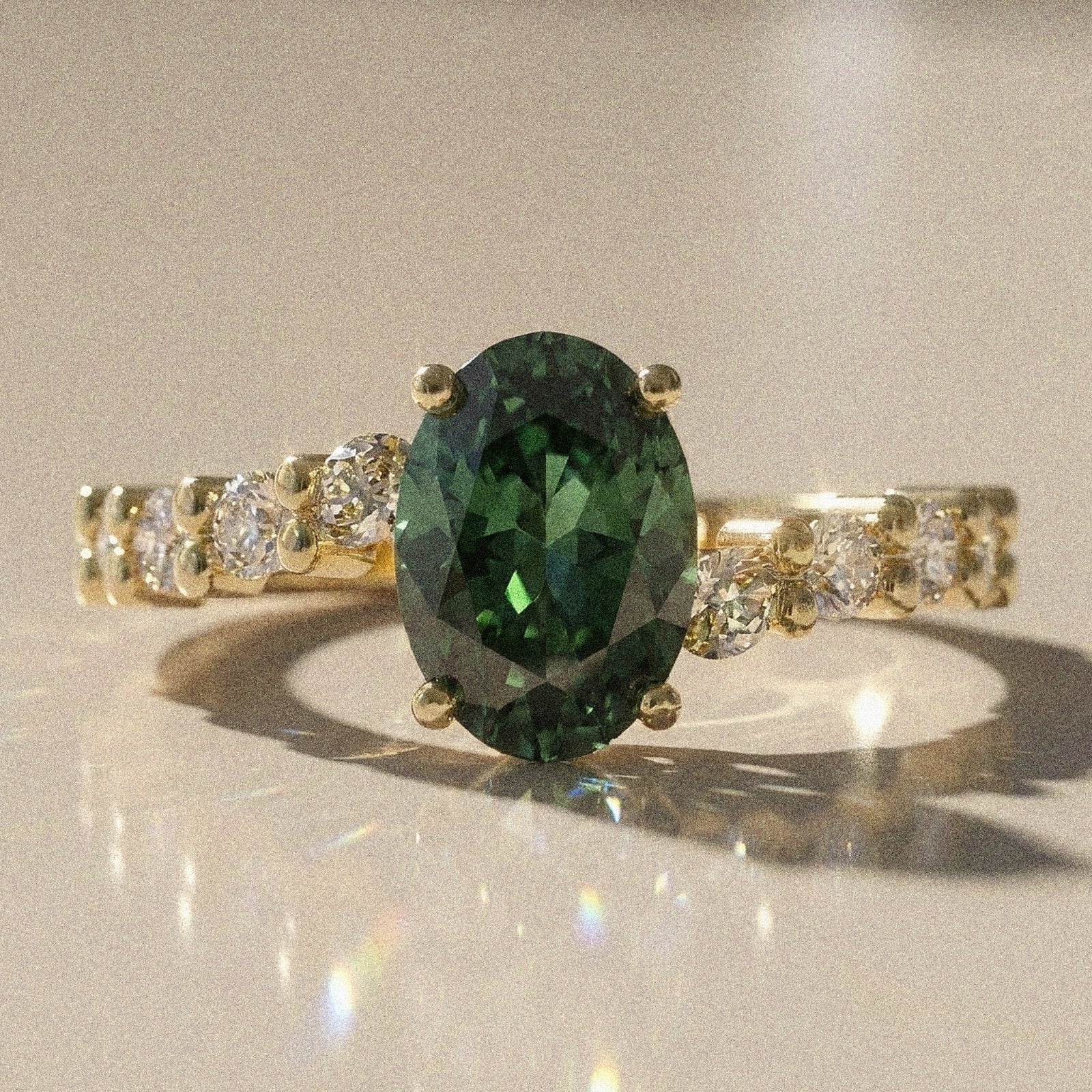 Bergenie - Oval stone engagement ring with side stones