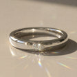 Aurora mixed wedding band – pear-shaped stone