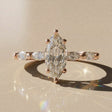 Leontina - engagement ring with a central stone accompanied