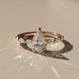 Madeleine - Solitaire accompanied pear-shaped