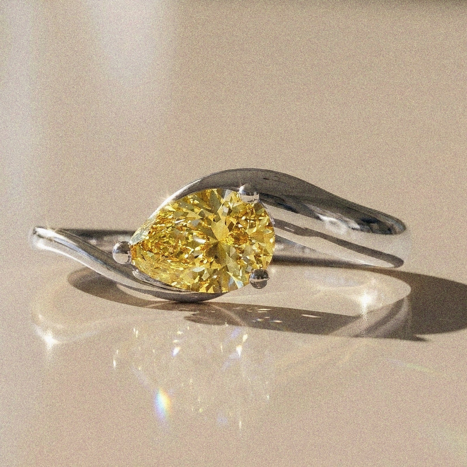 Berenice - Pear-shaped solitaire engagement ring